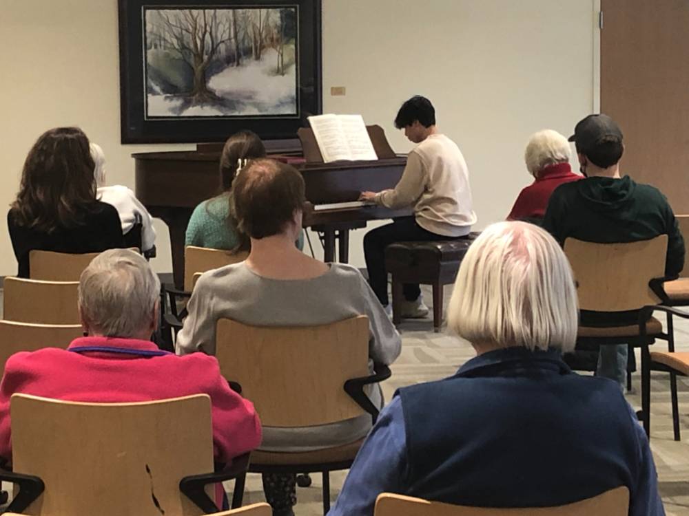 Audience listening to piano